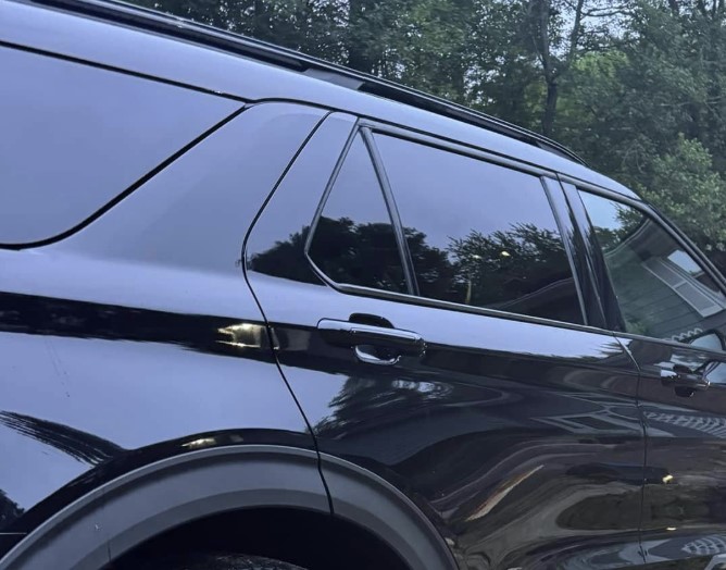 Water beading and rolling off a ceramic coated vehicle after rain