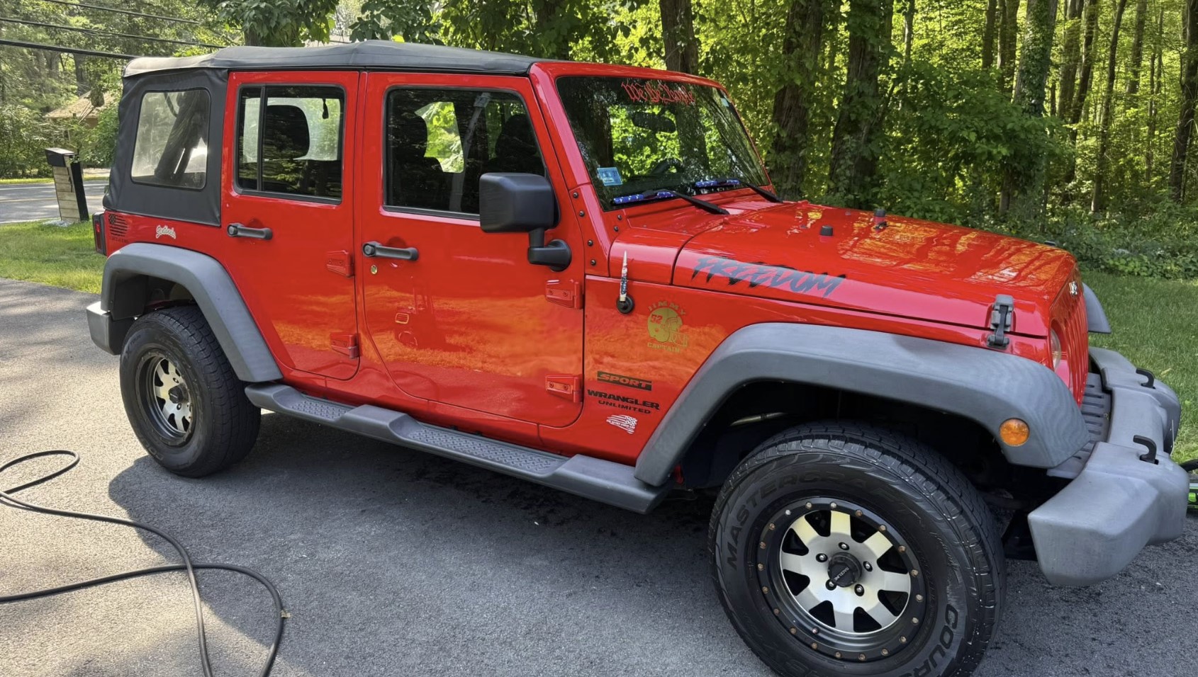 Detailed SUV exterior beading water after a protective coating in Rhode Island