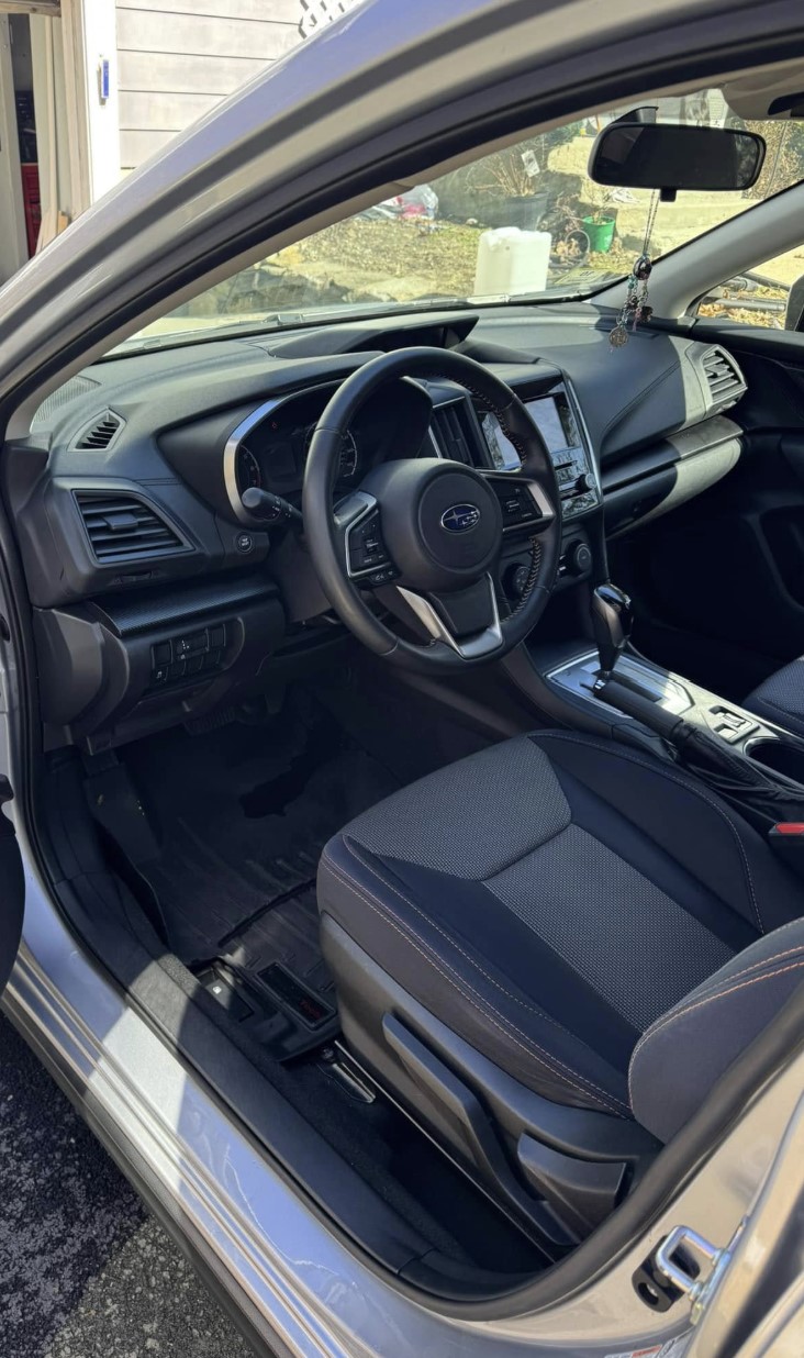 Subaru interior detailed with cleaned dash, steering wheel, and seats